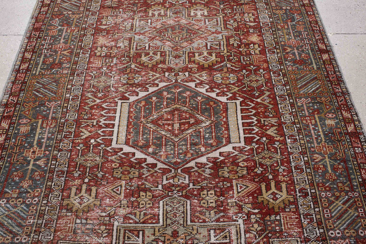 4' x 13' one-of-a-kind handmade antique Karaje runner rug. Color palette: rust, indigo, ivory, terracotta, charcoal, sienna