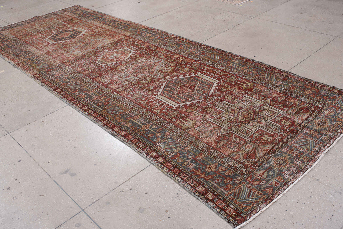 4' x 13' one-of-a-kind handmade antique Karaje runner rug. Color palette: rust, indigo, ivory, terracotta, charcoal, sienna