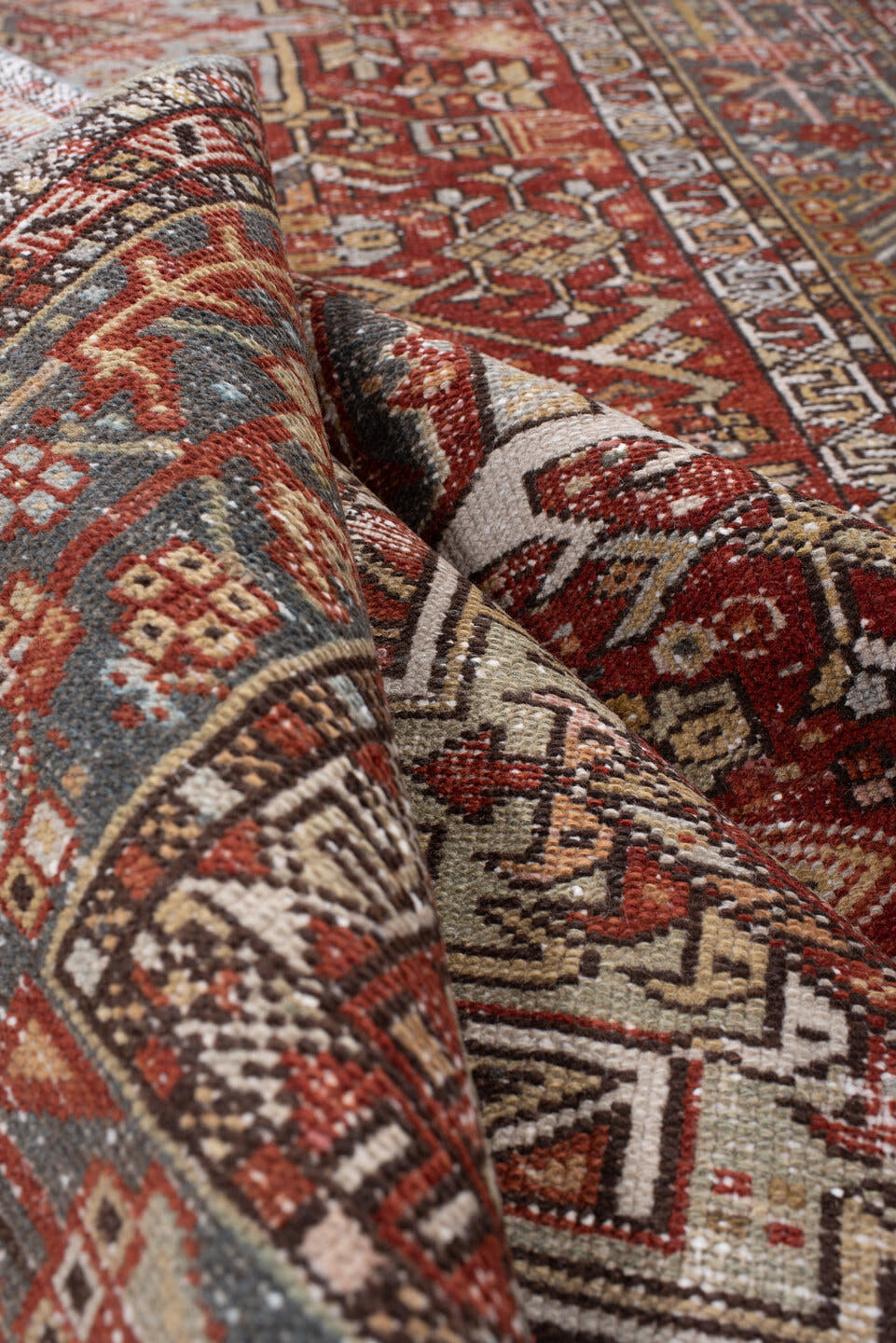 4' x 13' one-of-a-kind handmade antique Karaje runner rug. Color palette: rust, indigo, ivory, terracotta, charcoal, sienna