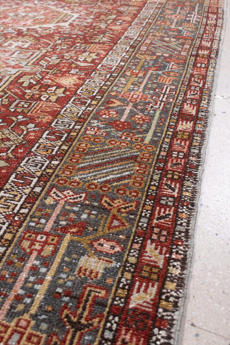 4' x 13' one-of-a-kind handmade antique Karaje runner rug. Color palette: rust, indigo, ivory, terracotta, charcoal, sienna