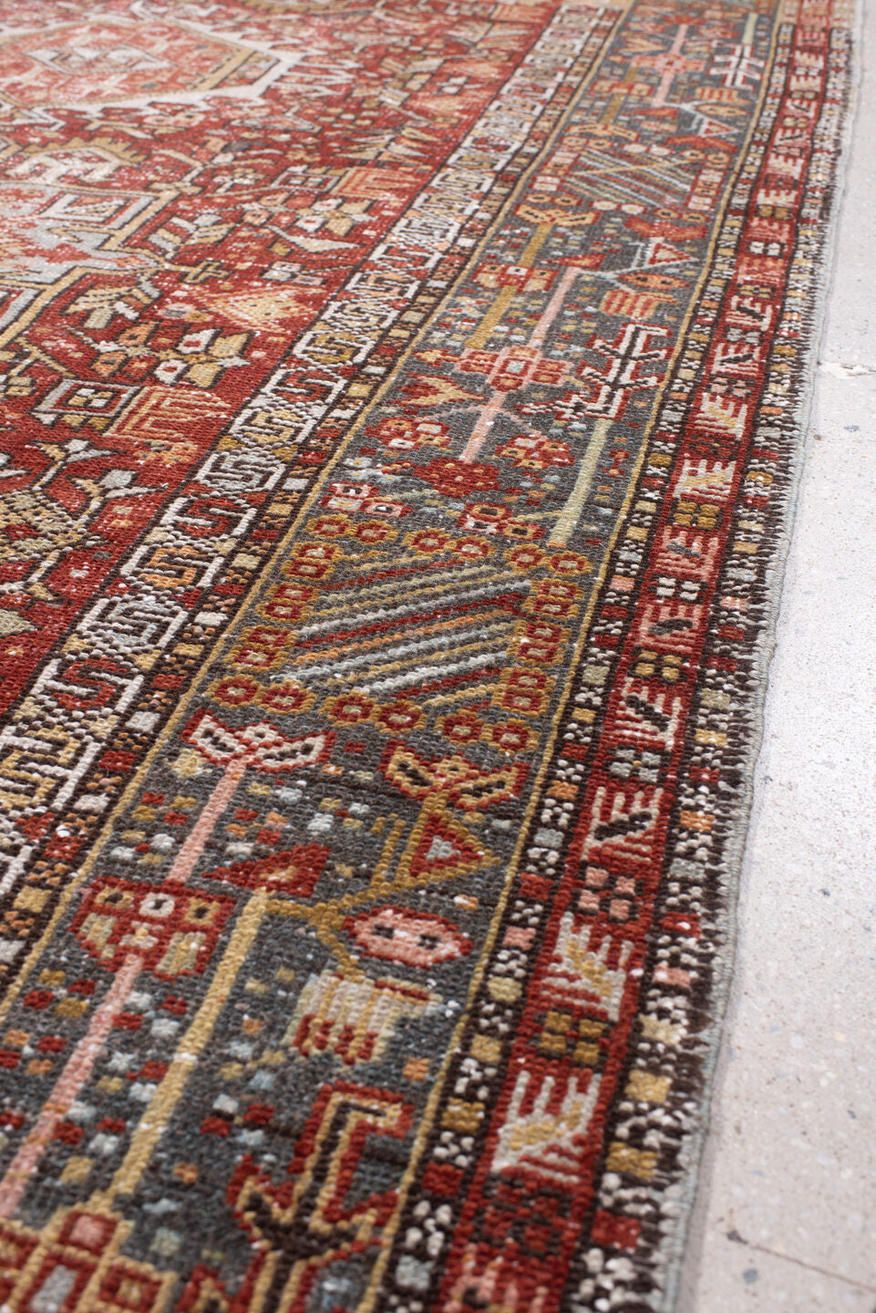 4' x 13' one-of-a-kind handmade antique Karaje runner rug. Color palette: rust, indigo, ivory, terracotta, charcoal, sienna