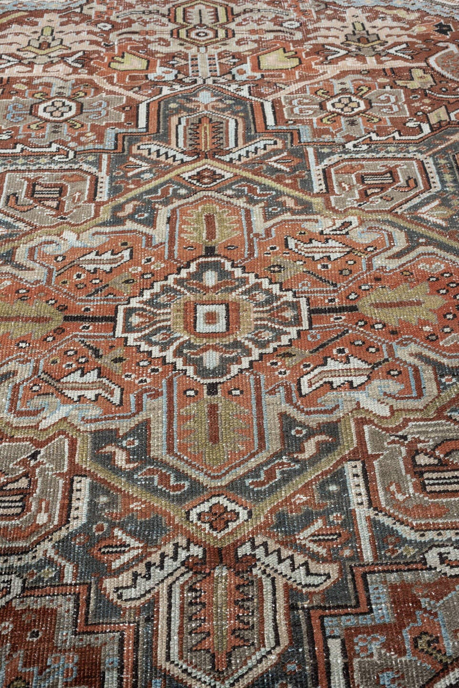 8' x 11' one-of-a-kind handmade antique Heriz large size rug. Color palette: terracotta, blue gray, ivory, charcoal, rust