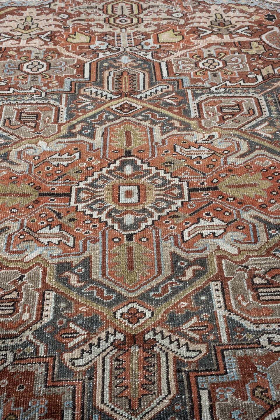 8' x 11' one-of-a-kind handmade antique Heriz large size rug. Color palette: terracotta, blue gray, ivory, charcoal, rust