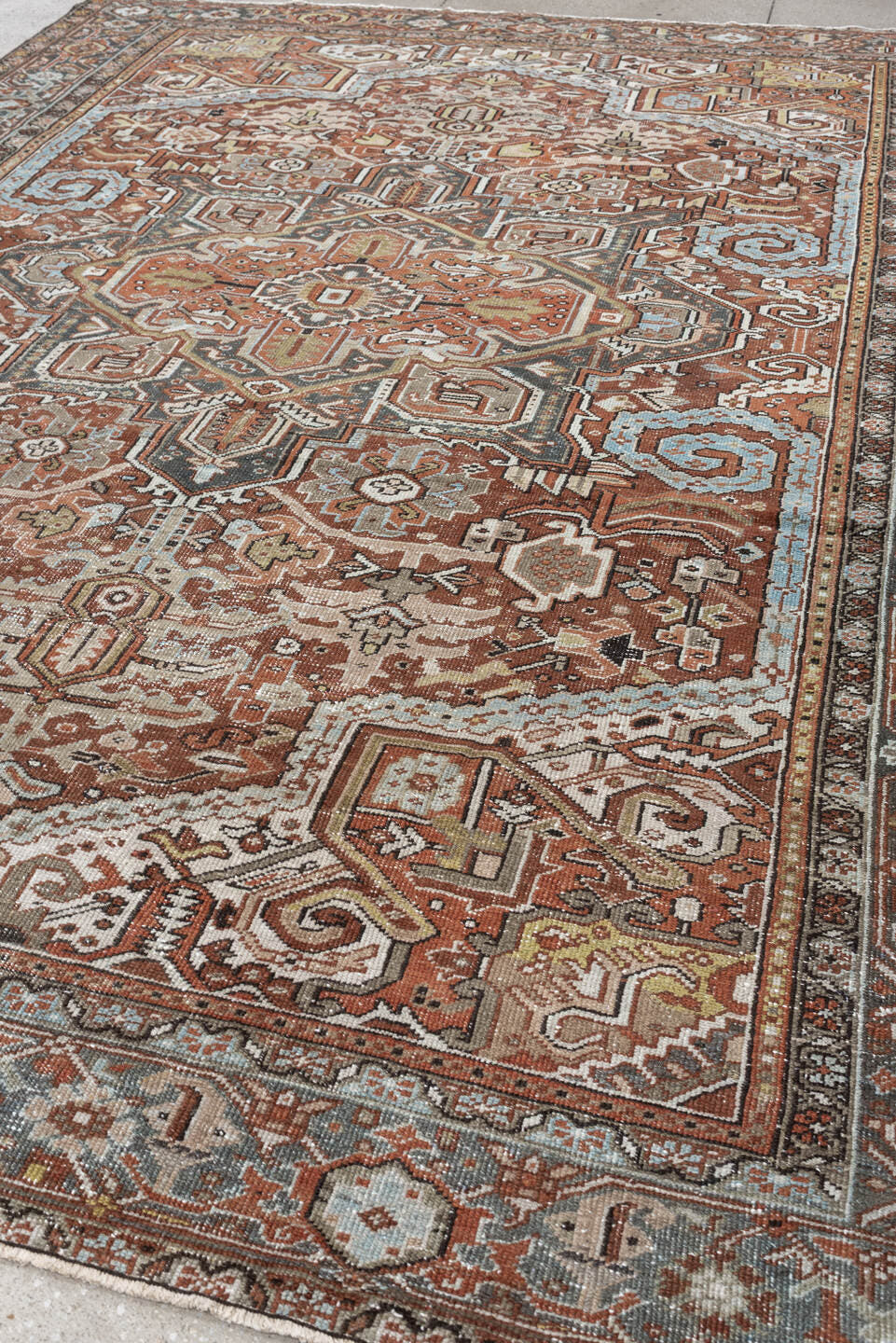 8' x 11' one-of-a-kind handmade antique Heriz large size rug. Color palette: terracotta, blue gray, ivory, charcoal, rust