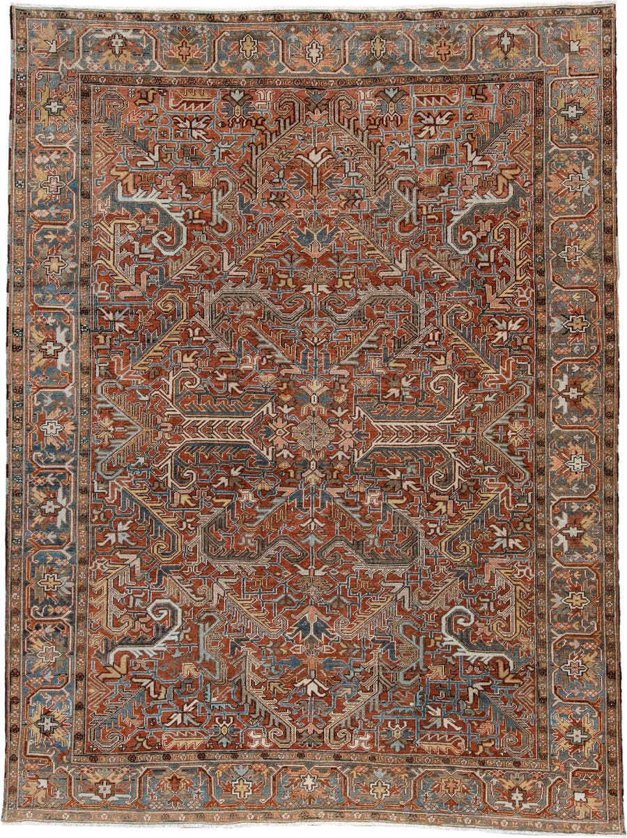 8' x 11' one-of-a-kind handmade antique Heriz large size rug. Color palette: rust, slate blue, ivory, camel, charcoal
