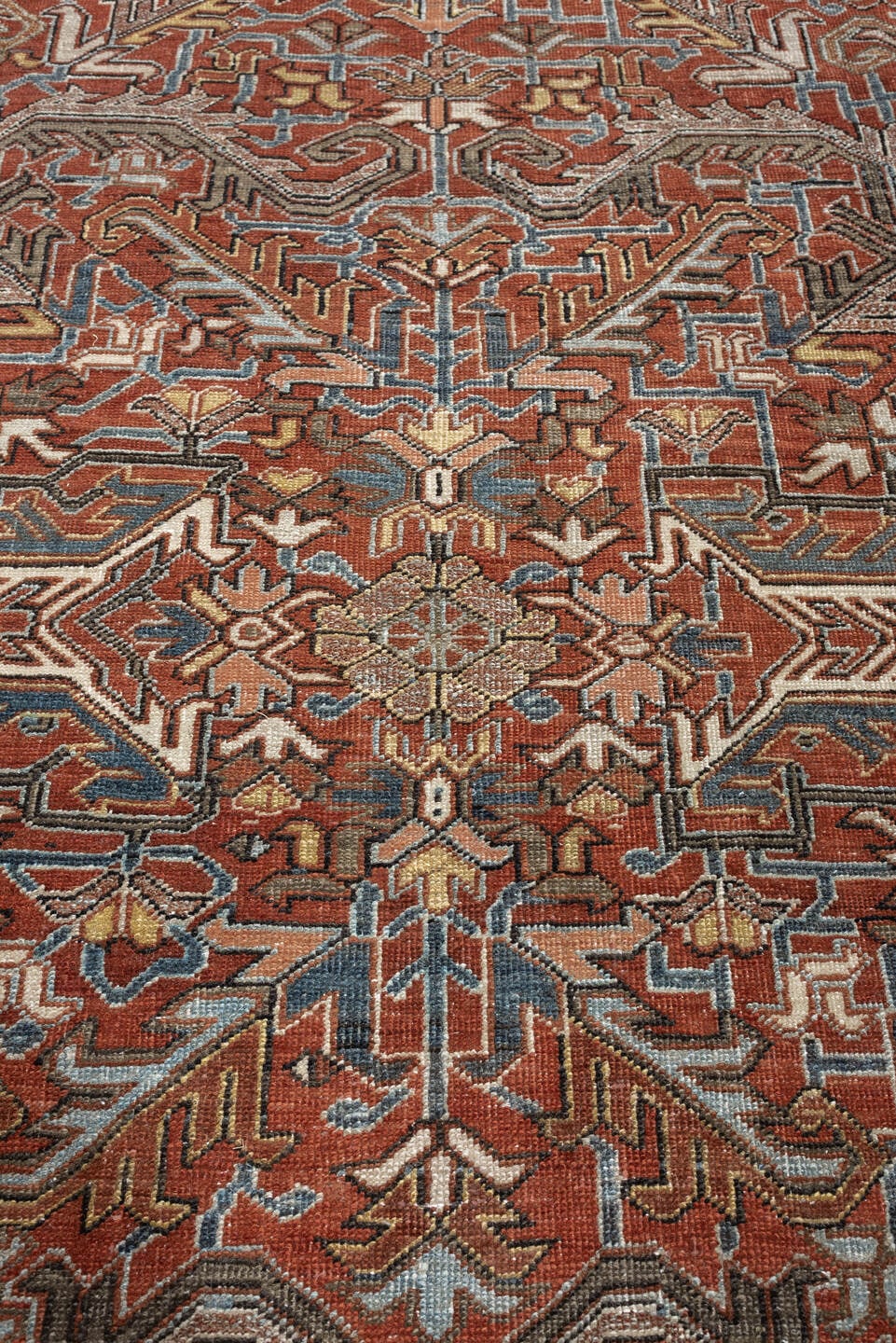 8' x 11' one-of-a-kind handmade antique Heriz large size rug. Color palette: rust, slate blue, ivory, camel, charcoal
