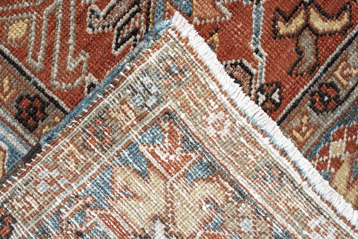 8' x 11' one-of-a-kind handmade antique Heriz large size rug. Color palette: rust, slate blue, ivory, camel, charcoal