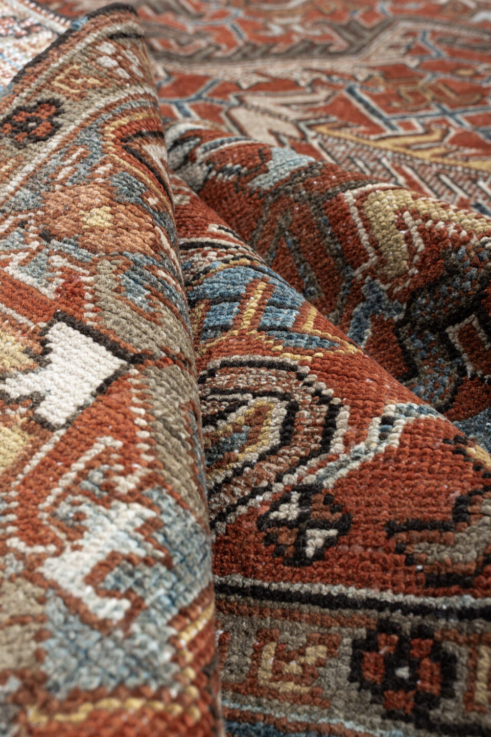 8' x 11' one-of-a-kind handmade antique Heriz large size rug. Color palette: rust, slate blue, ivory, camel, charcoal