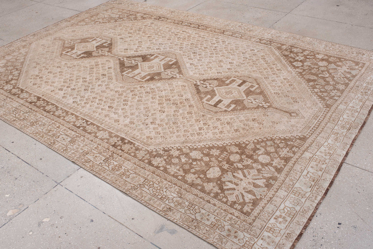 7' x 10' one-of-a-kind handmade antique Shhiraz large size rug. Color palette: ivory, taupe, camel, cocoa, sand, rose beige