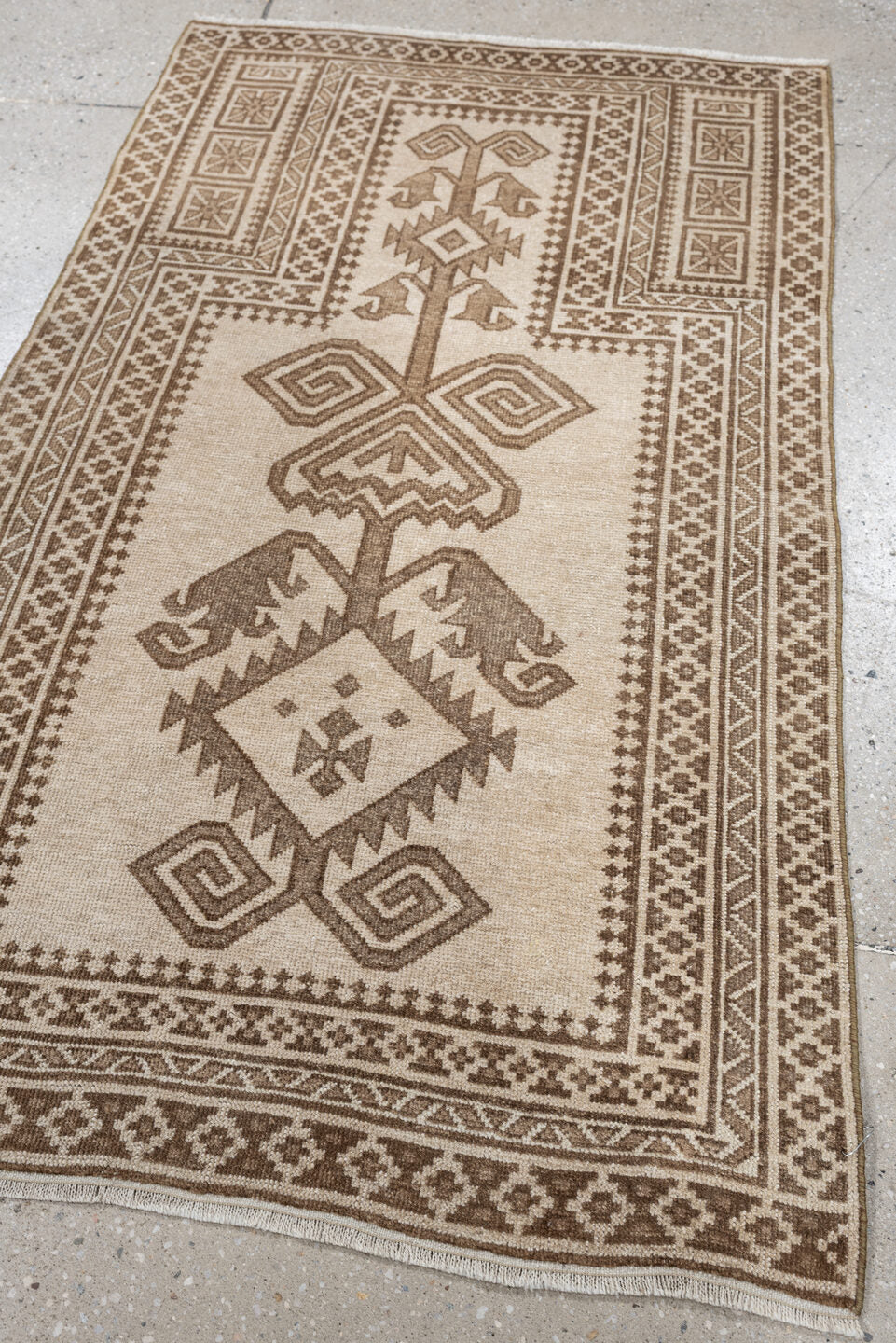 2' x 4' one-of-a-kind handmade antique Belouch small size rug. Color palette: ivory, taupe, camel, brown, beige, gray