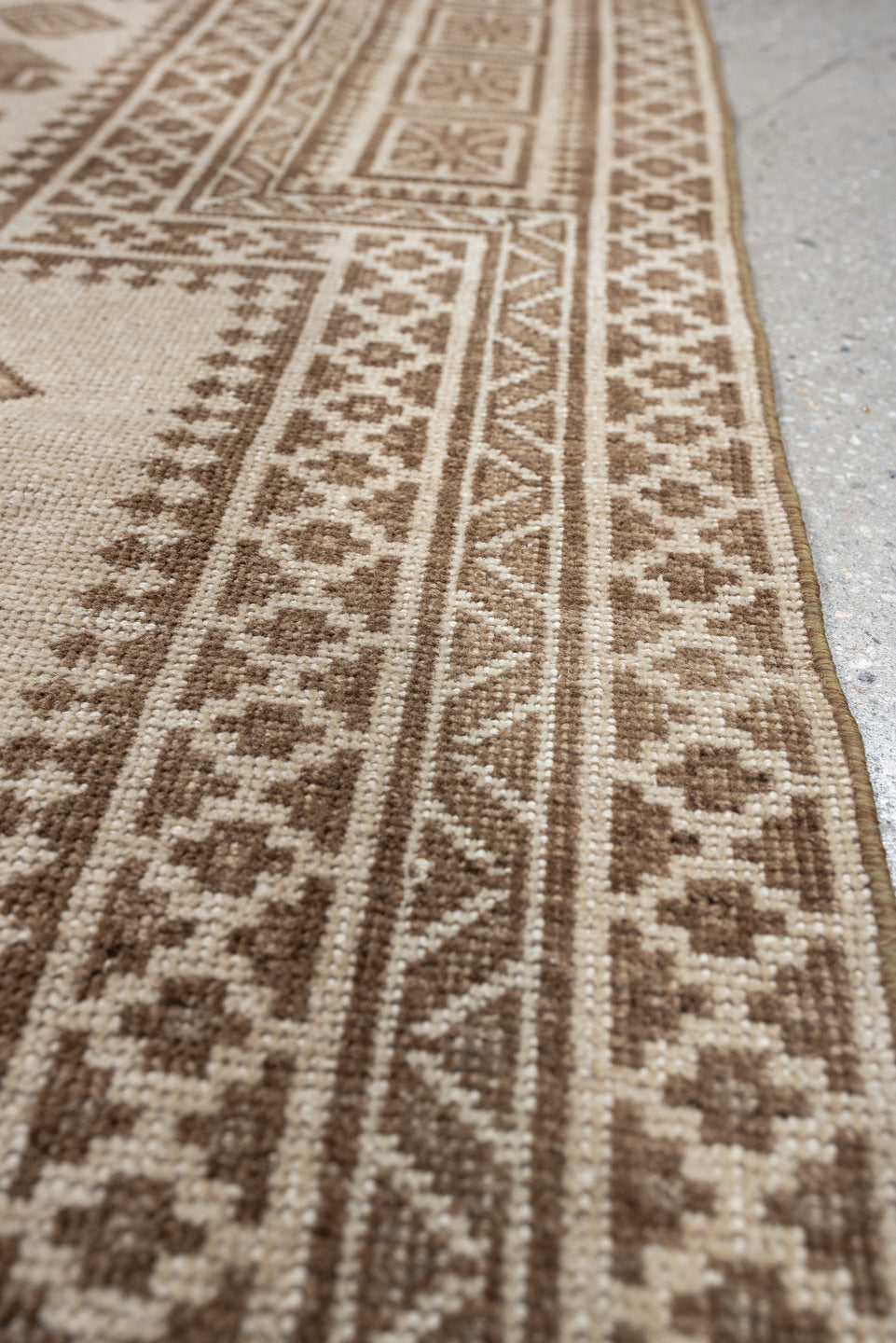 2' x 4' one-of-a-kind handmade antique Belouch small size rug. Color palette: ivory, taupe, camel, brown, beige, gray