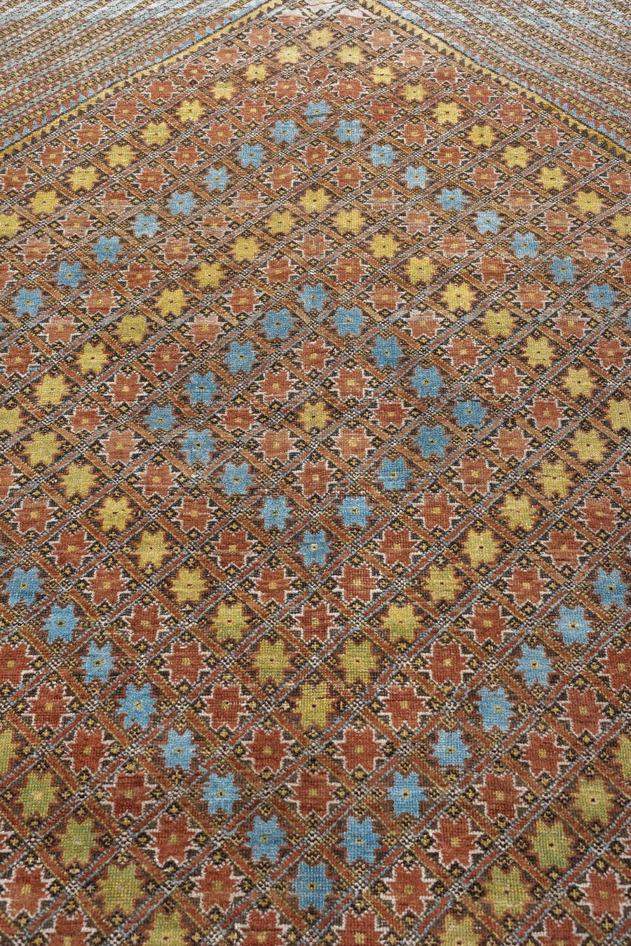 5' x 6' one-of-a-kind handmade antique Afshar rug. Color palette: terracotta, ivory, muted blue, gold, rust, sage, charcoal