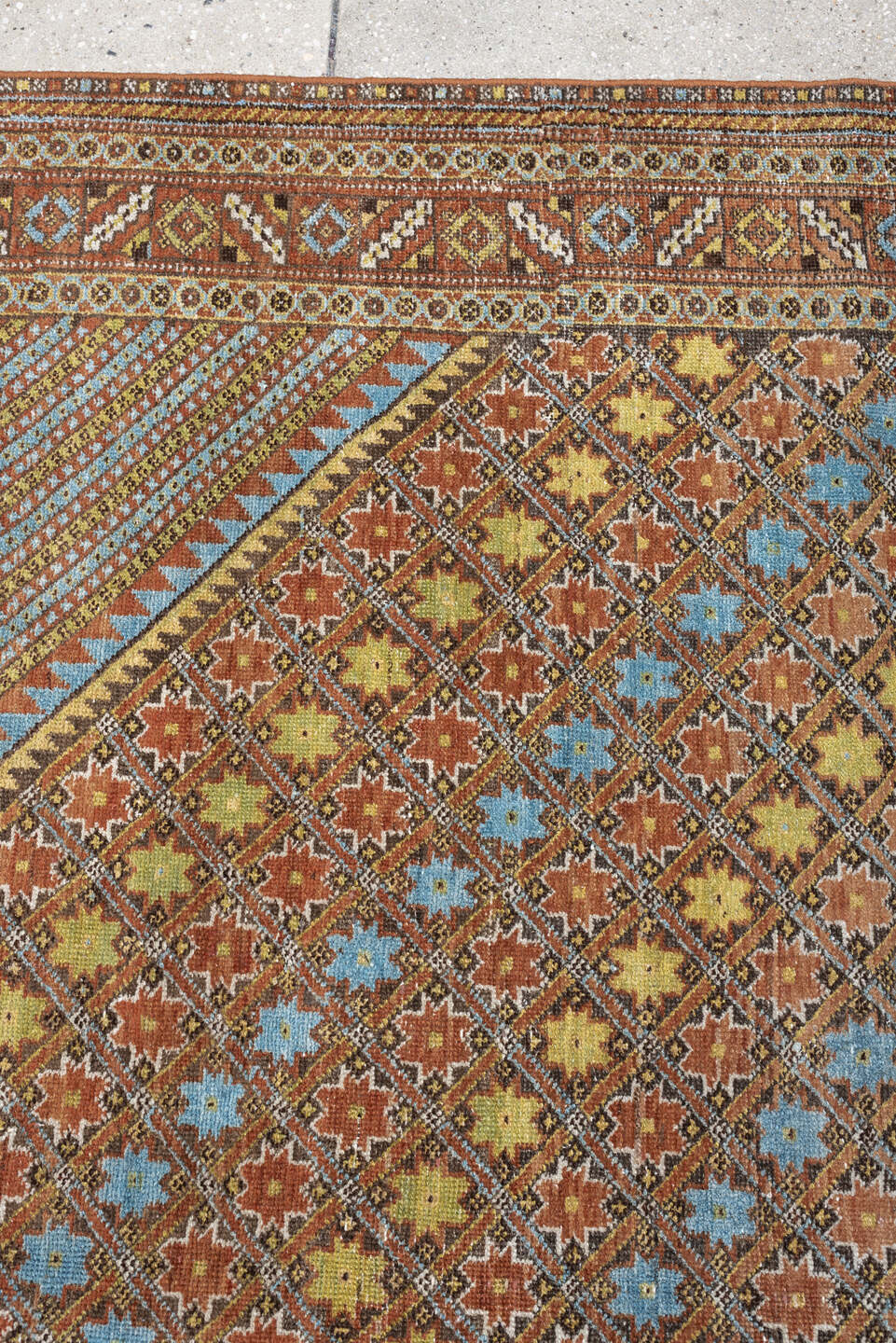5' x 6' one-of-a-kind handmade antique Afshar rug. Color palette: terracotta, ivory, muted blue, gold, rust, sage, charcoal