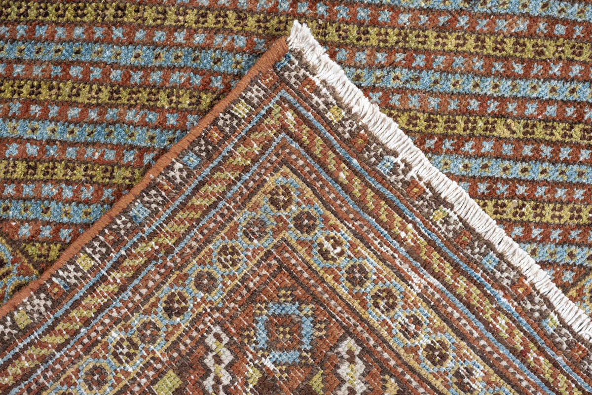 5' x 6' one-of-a-kind handmade antique Afshar rug. Color palette: terracotta, ivory, muted blue, gold, rust, sage, charcoal