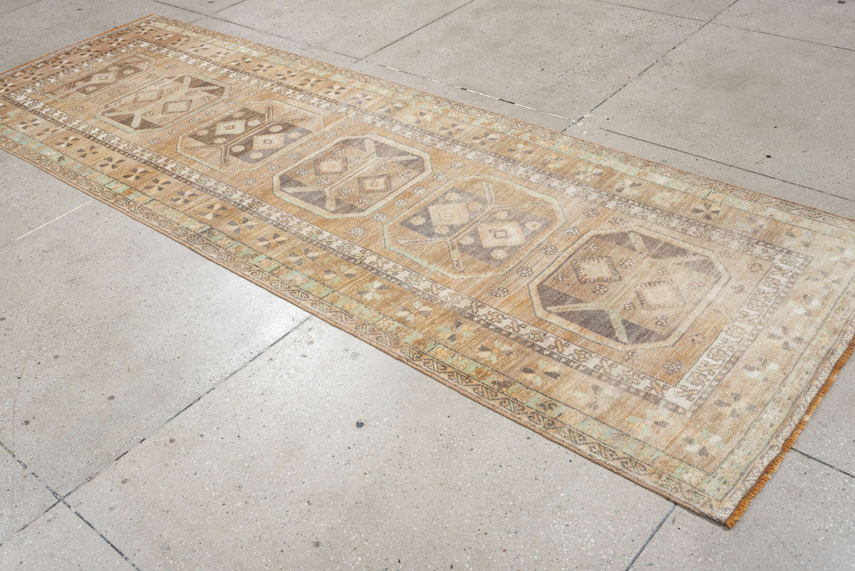 3' x 10' one-of-a-kind handmade antique Anatolian runner rug. Color palette: camel, ivory, taupe, charcoal, sage, terracotta