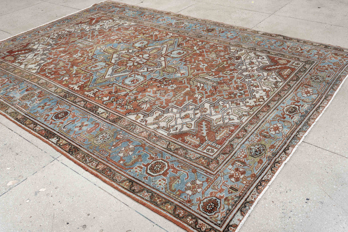 7' x 10' one-of-a-kind handmade antique Heriz large size rug. Color palette: rust, powder blue, ivory, sage, terracotta