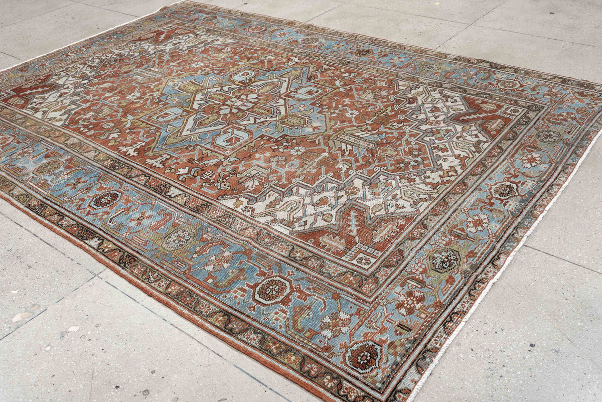7' x 10' one-of-a-kind handmade antique Heriz large size rug. Color palette: rust, powder blue, ivory, sage, terracotta