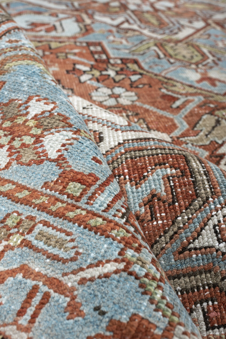 7' x 10' one-of-a-kind handmade antique Heriz large size rug. Color palette: rust, powder blue, ivory, sage, terracotta