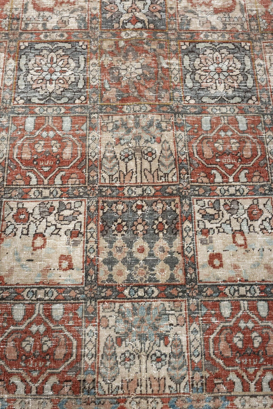 5' x 8' one-of-a-kind handmade antique Baktiary medium size rug. Color palette: terracotta, ivory, charcoal, slate blue