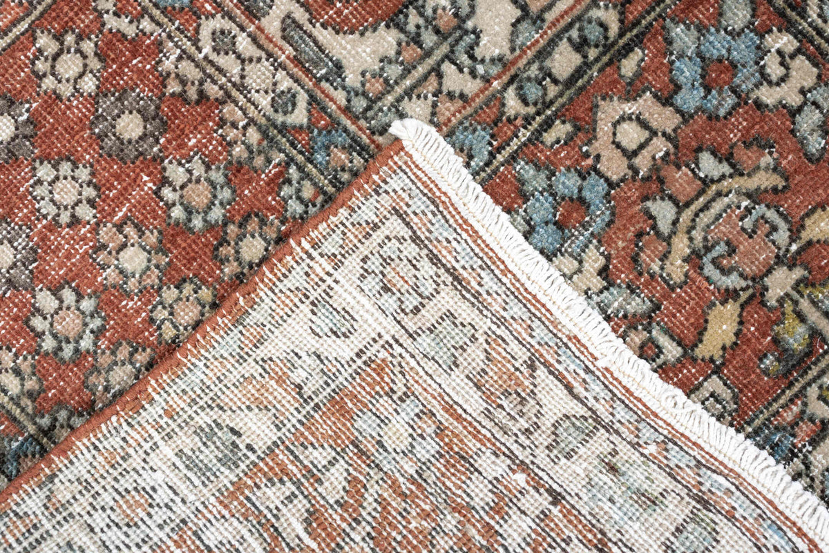 5' x 8' one-of-a-kind handmade antique Baktiary medium size rug. Color palette: terracotta, ivory, charcoal, slate blue