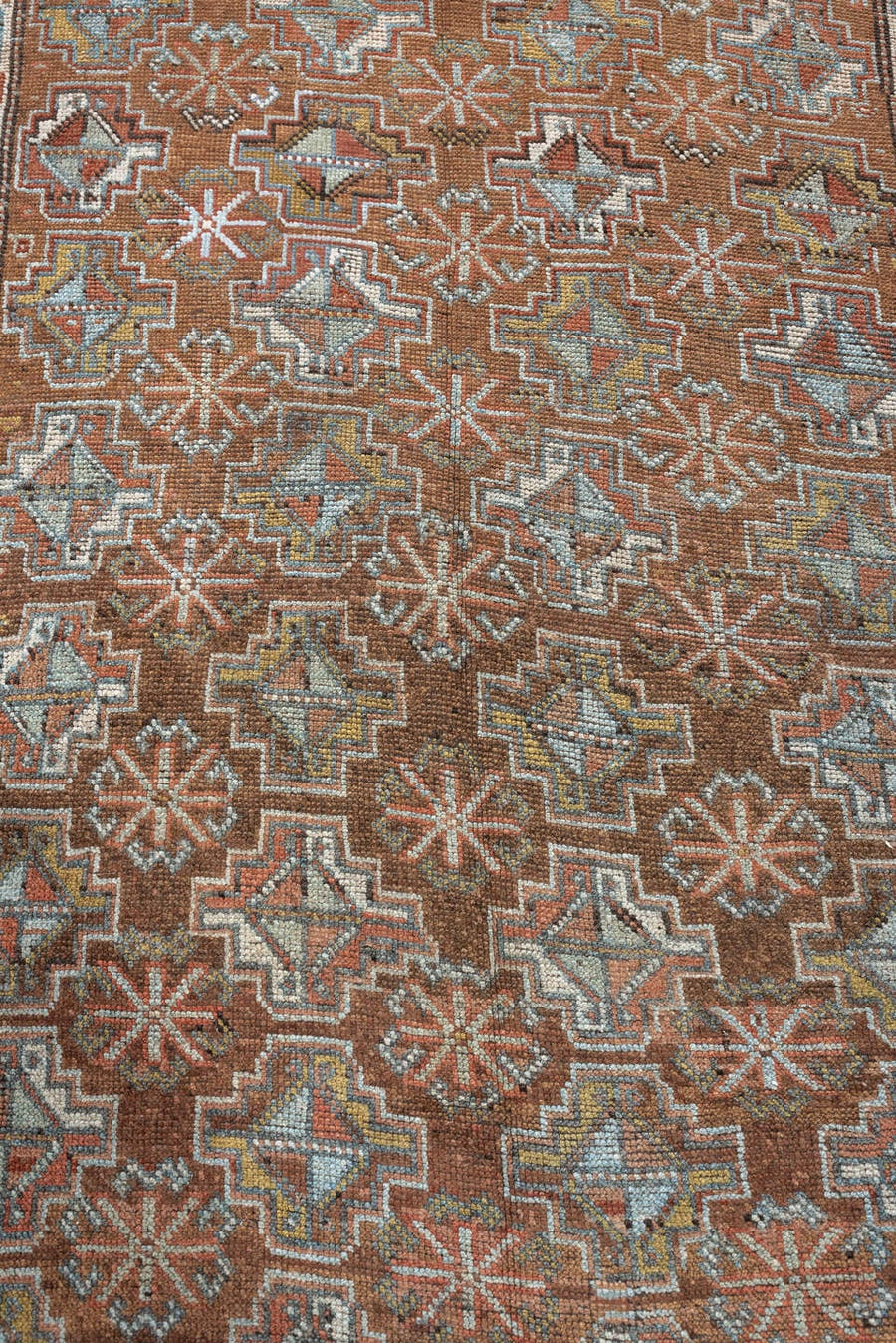 4' x 8' one-of-a-kind handmade antique Kurd runner rug. Color palette: rust, terracotta, blue gray, ivory, brown, charcoal