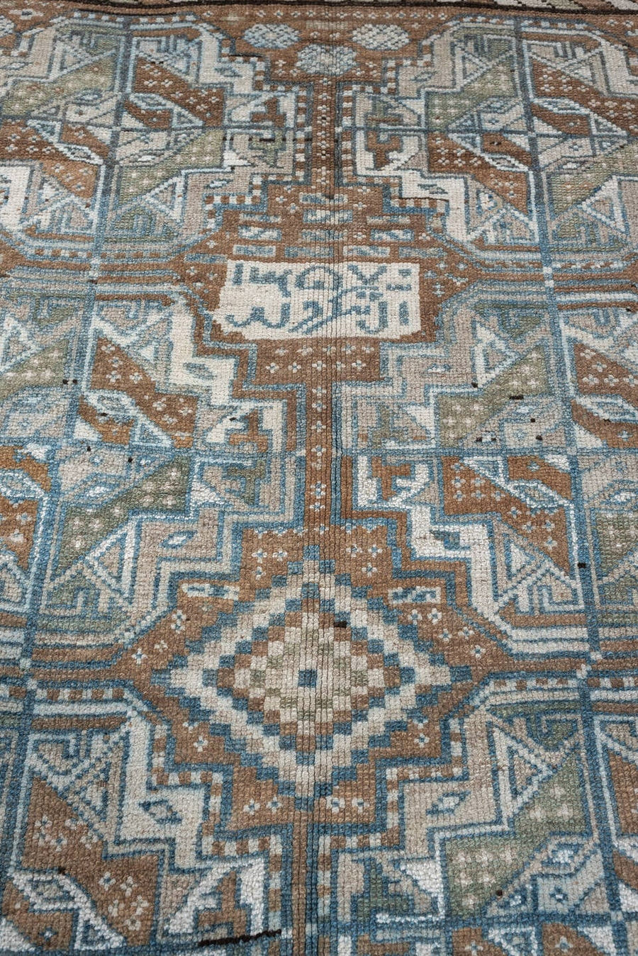 5' x 6' one-of-a-kind handmade antique Kurd rug. Color palette: camel, ivory, blue gray, dark brown, taupe, rust, sage