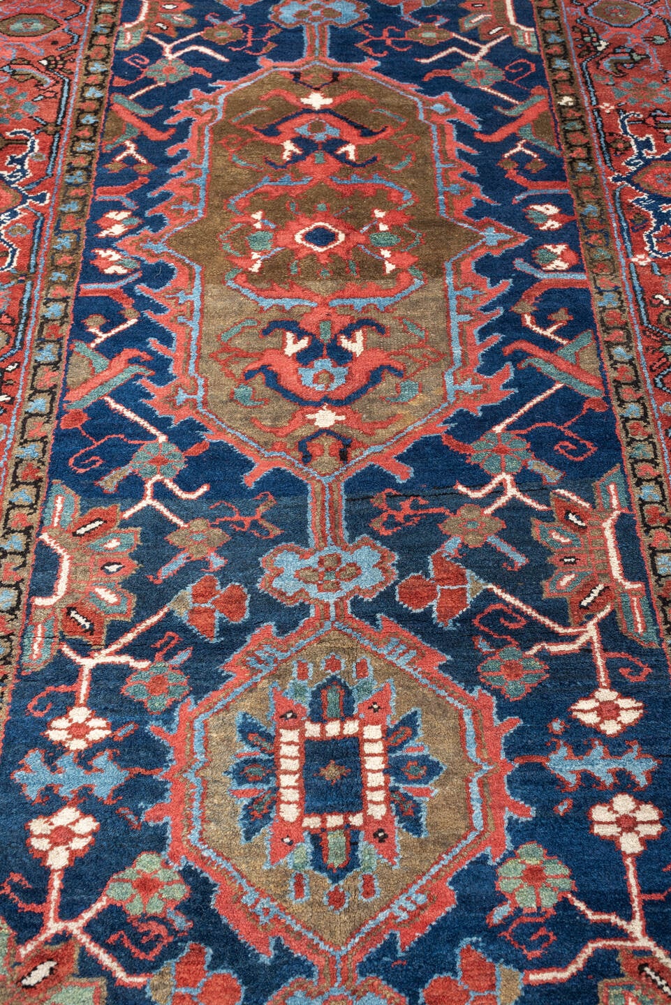 3' x 18' one-of-a-kind handmade antique Serapi runner rug. Color palette: navy, brick red, rust, camel, ivory, muted teal