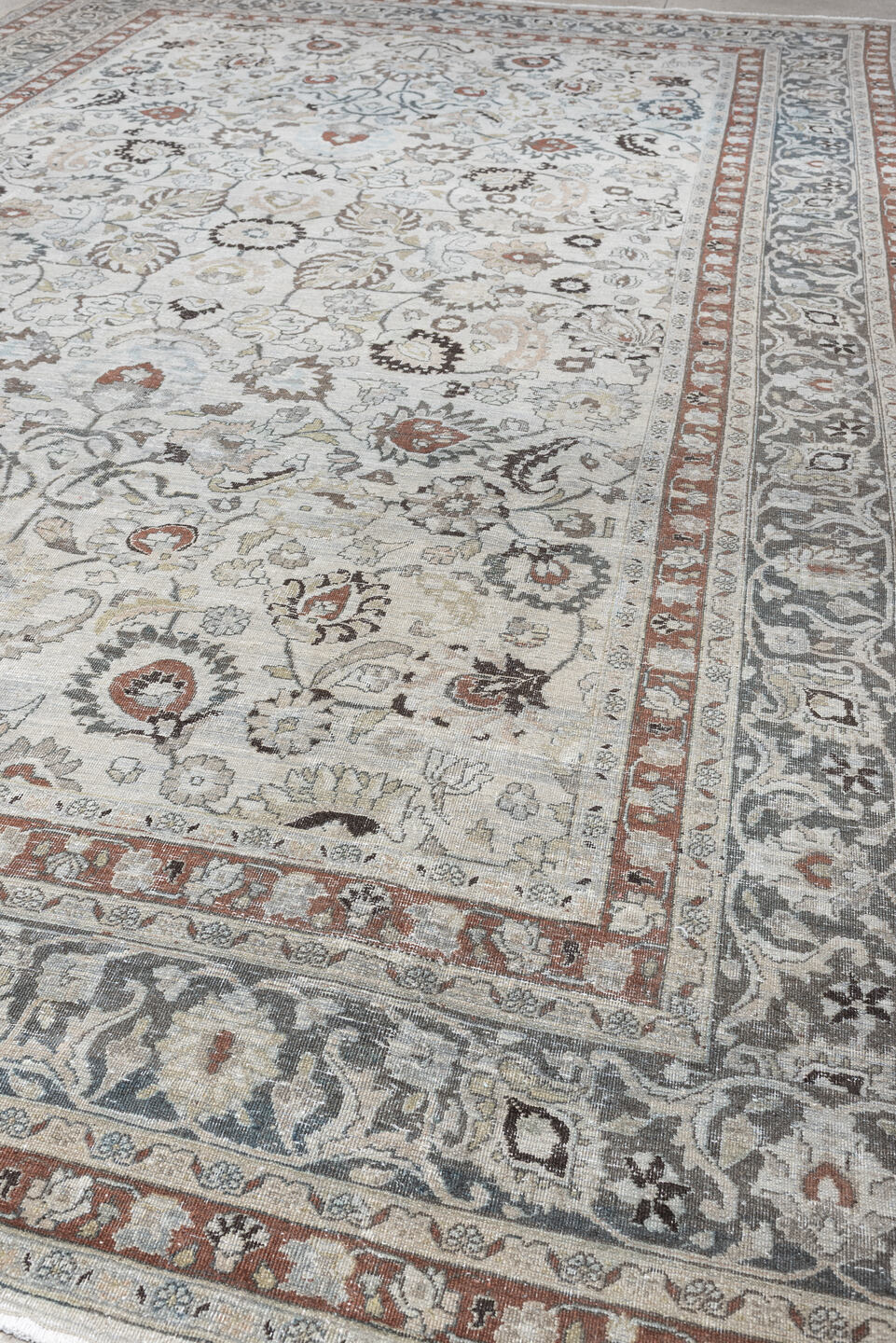 10' x 16' one-of-a-kind handmade antique Meshed rug. Color palette: ivory, slate blue, terracotta, taupe, charcoal, cream