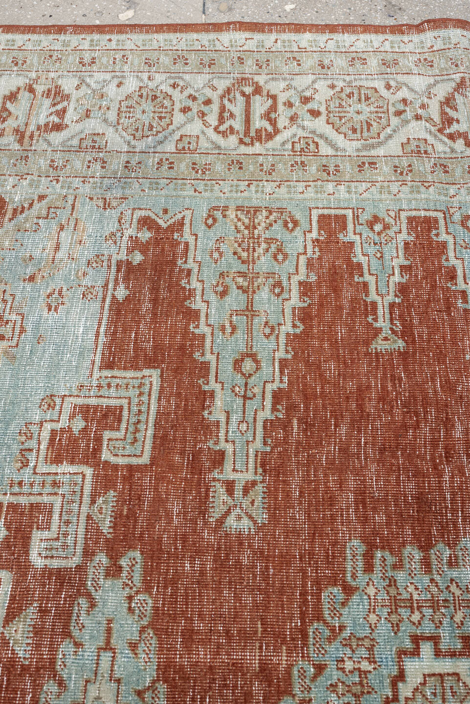 8' x 7' one-of-a-kind handmade antique Veece rug. Color palette: terracotta, ivory, pale blue gray, rust, taupe, sage, coral