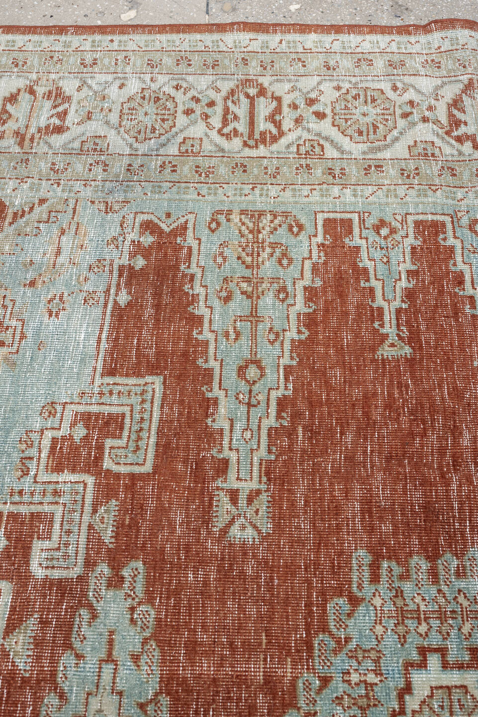 8' x 7' one-of-a-kind handmade antique Veece rug. Color palette: terracotta, ivory, pale blue gray, rust, taupe, sage, coral