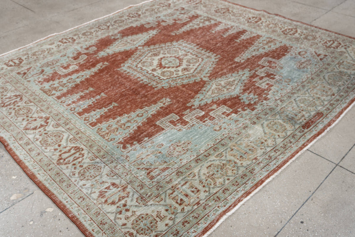8' x 7' one-of-a-kind handmade antique Veece rug. Color palette: terracotta, ivory, pale blue gray, rust, taupe, sage, coral