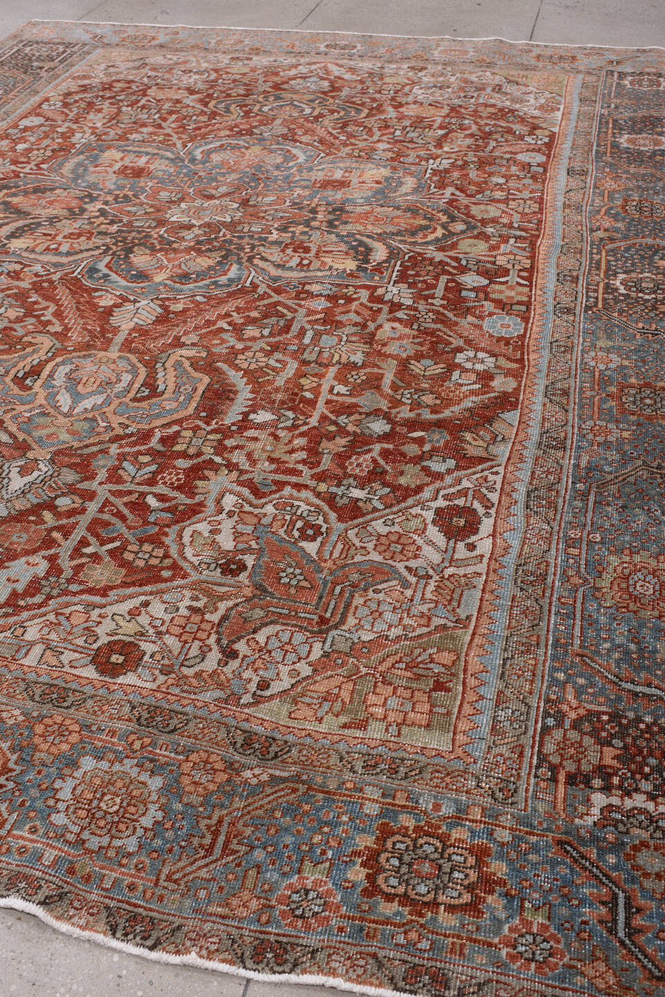 8' x 11' one-of-a-kind handmade antique Heriz large size rug. Color palette: rust, powder blue, ivory, navy, terracotta