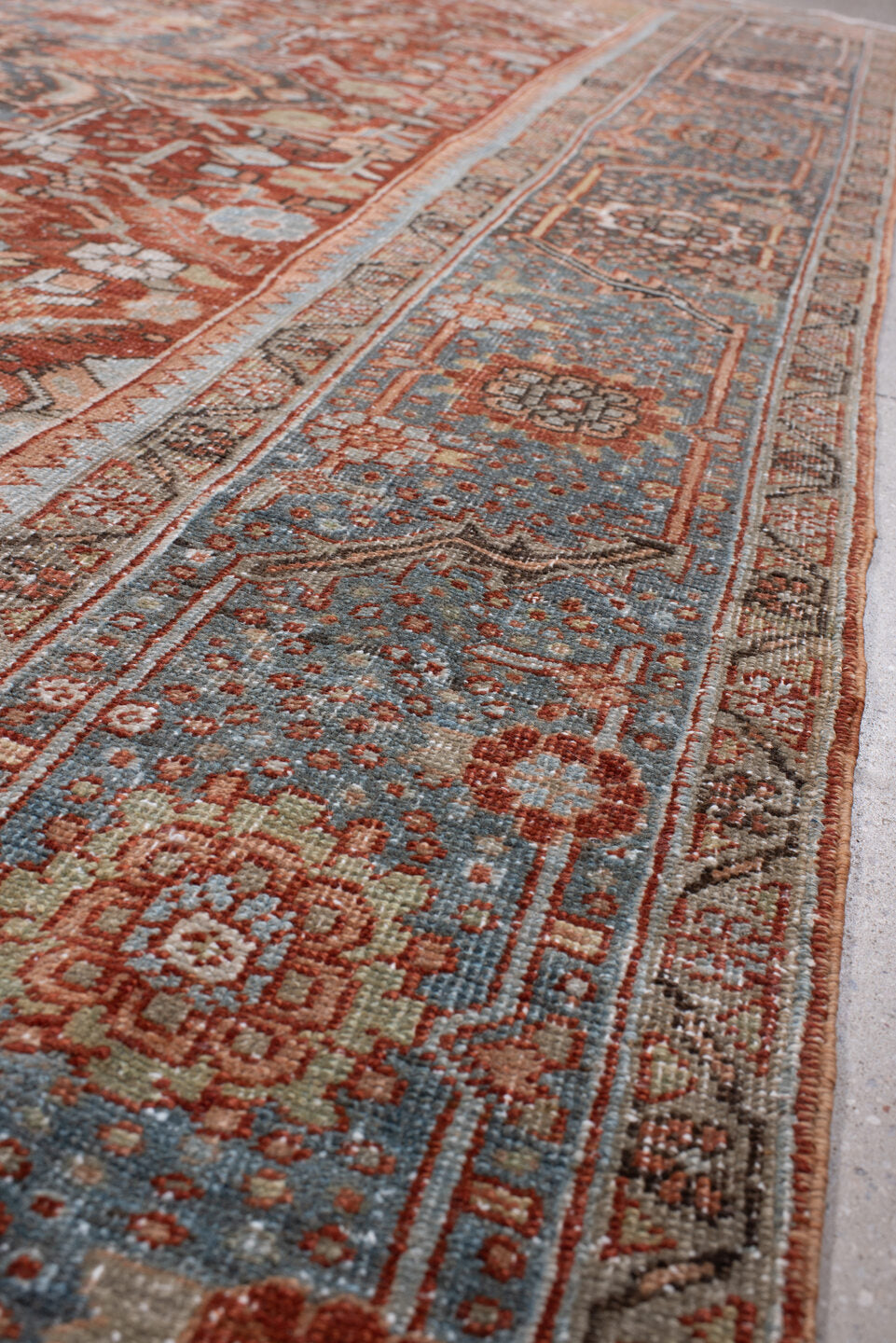 8' x 11' one-of-a-kind handmade antique Heriz large size rug. Color palette: rust, powder blue, ivory, navy, terracotta