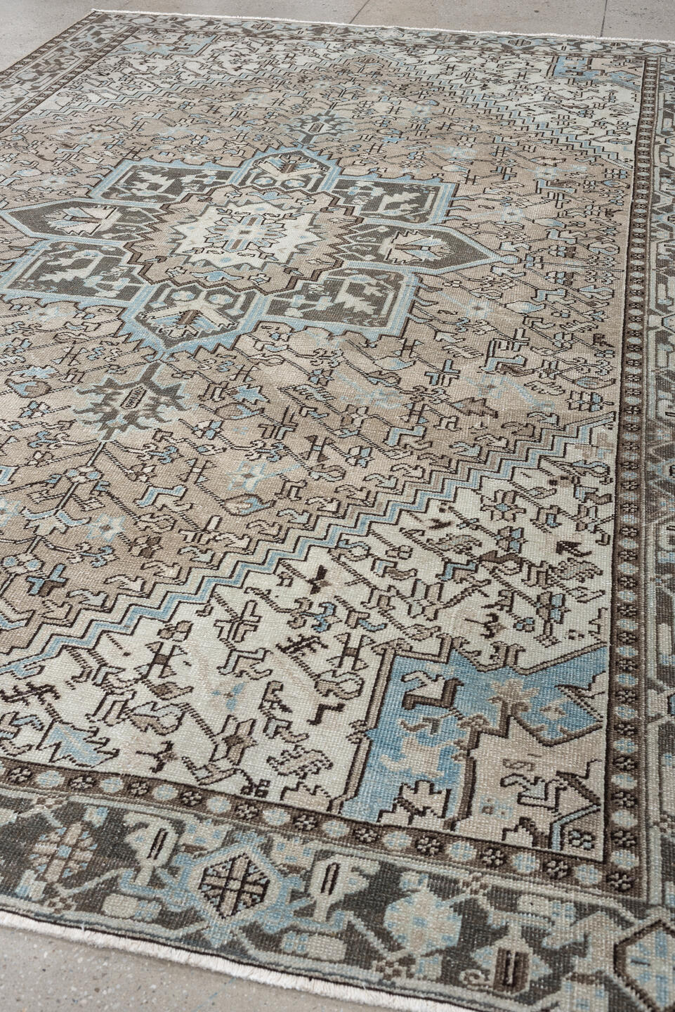 7' x 11' one-of-a-kind handmade antique Heriz large size rug. Color palette: ivory, taupe, charcoal, slate blue, dark brown
