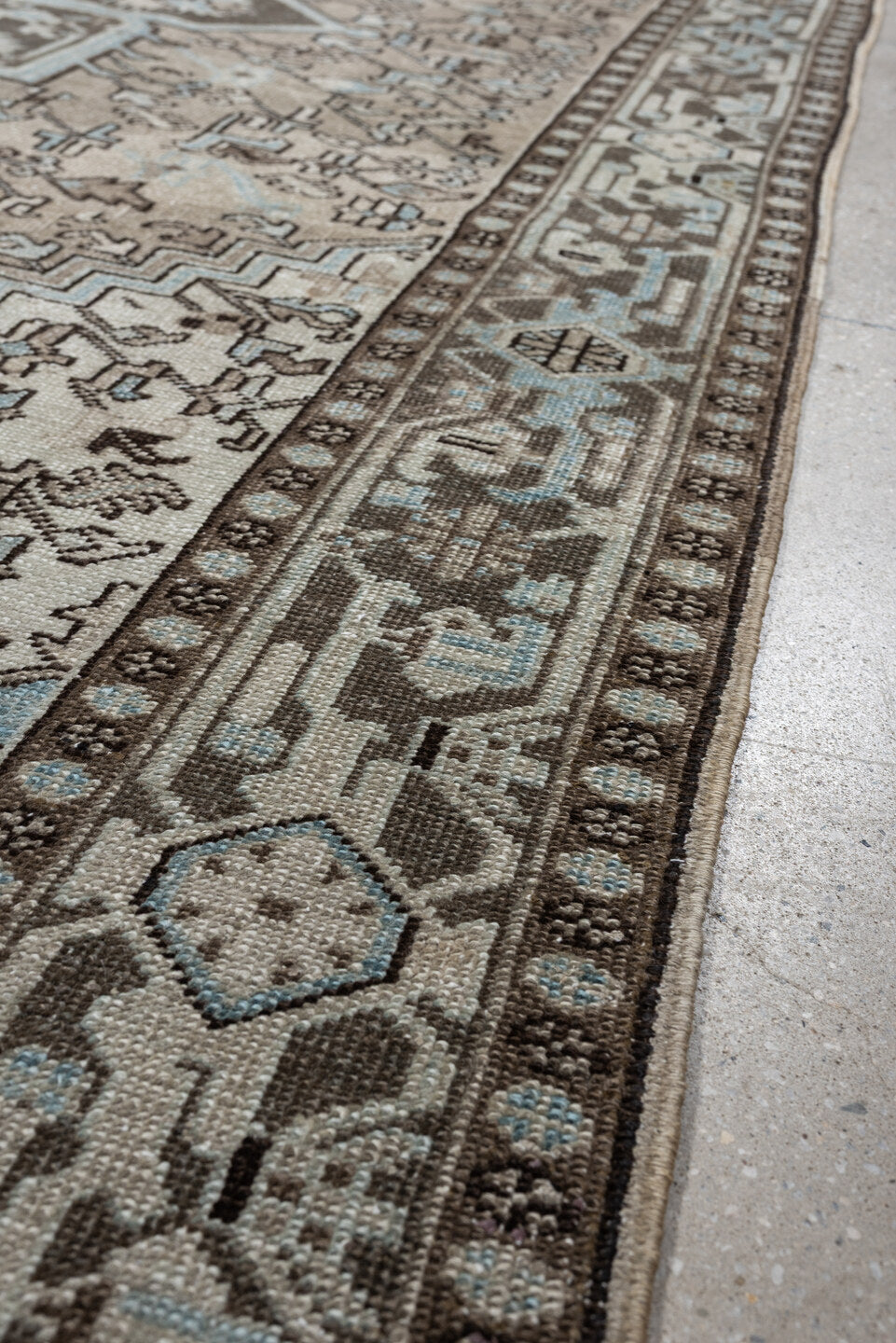 7' x 11' one-of-a-kind handmade antique Heriz large size rug. Color palette: ivory, taupe, charcoal, slate blue, dark brown