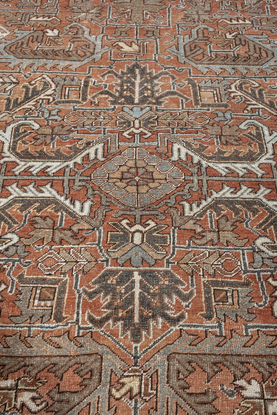 6' x 8' one-of-a-kind handmade antique Heriz medium size rug. Color palette: terracotta, charcoal, ivory, taupe, sage, slate