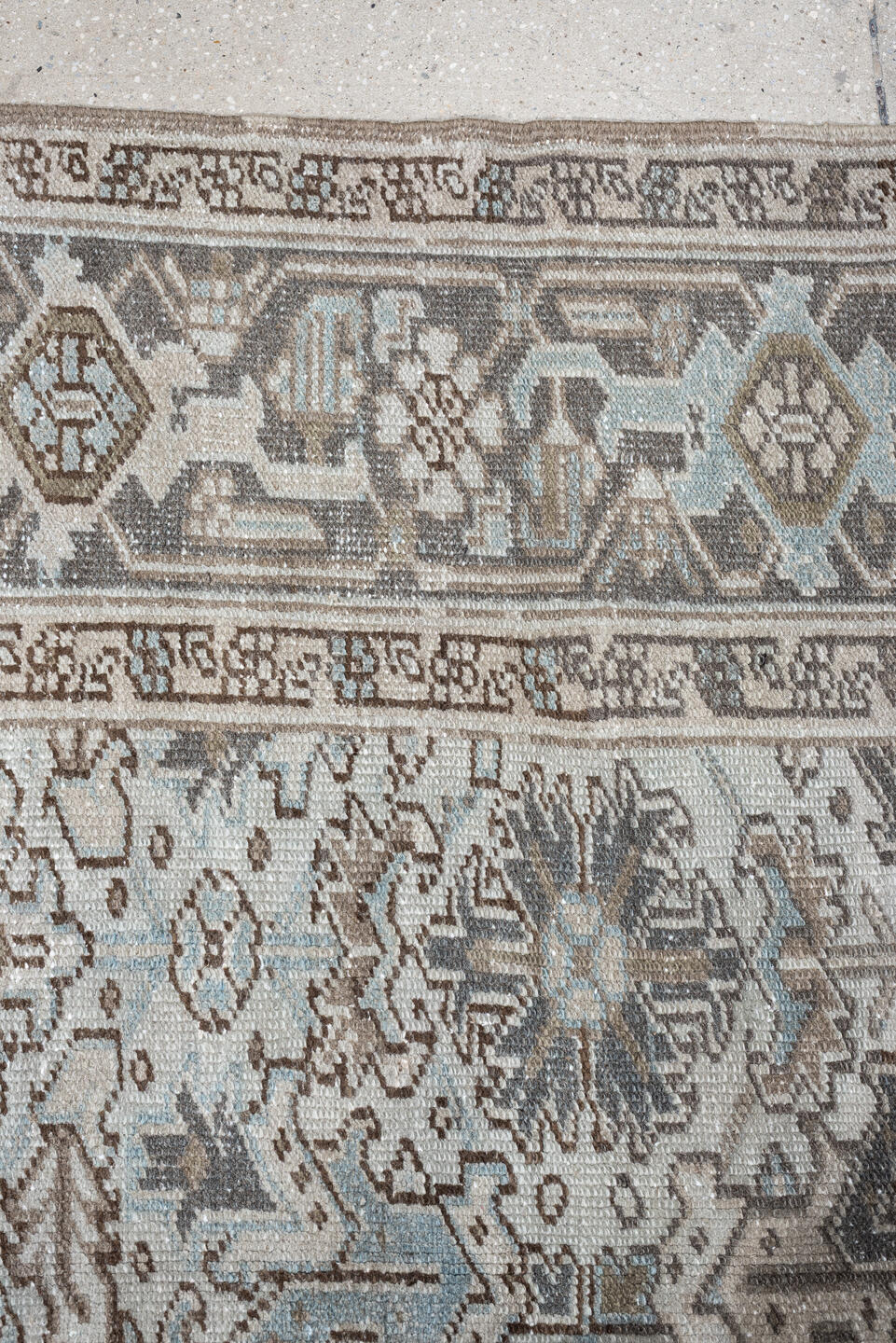 7' x 10' one-of-a-kind handmade antique Heriz large size rug. Color palette: ivory, taupe, charcoal, pale blue, brown, gray