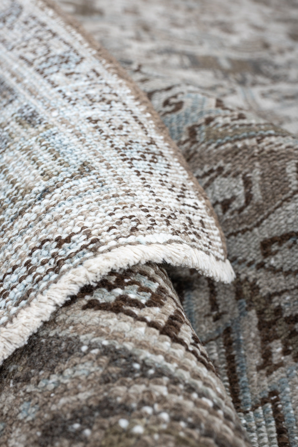 7' x 10' one-of-a-kind handmade antique Heriz large size rug. Color palette: ivory, taupe, charcoal, pale blue, brown, gray