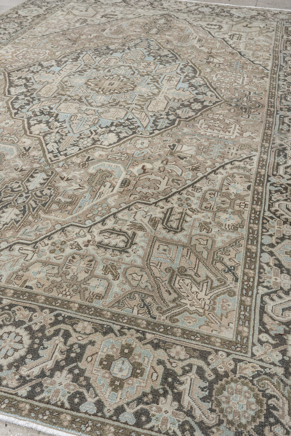 8' x 11' one-of-a-kind handmade antique Heriz large size rug. Color palette: taupe, ivory, charcoal, pale blue, camel, slate