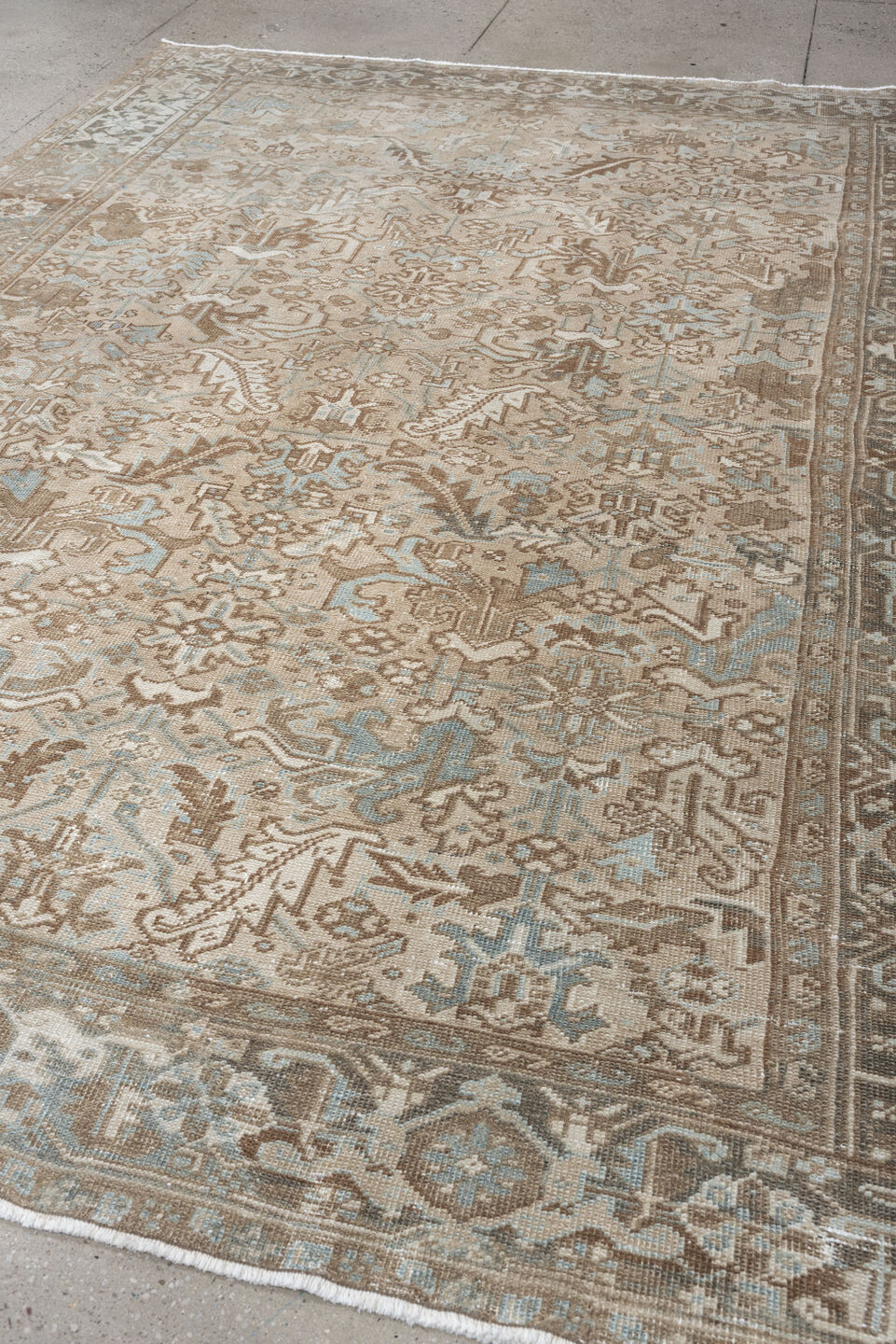 7' x 10' one-of-a-kind handmade antique Heriz large size rug. Color palette: taupe, brown, ivory, pale blue, charcoal, slate