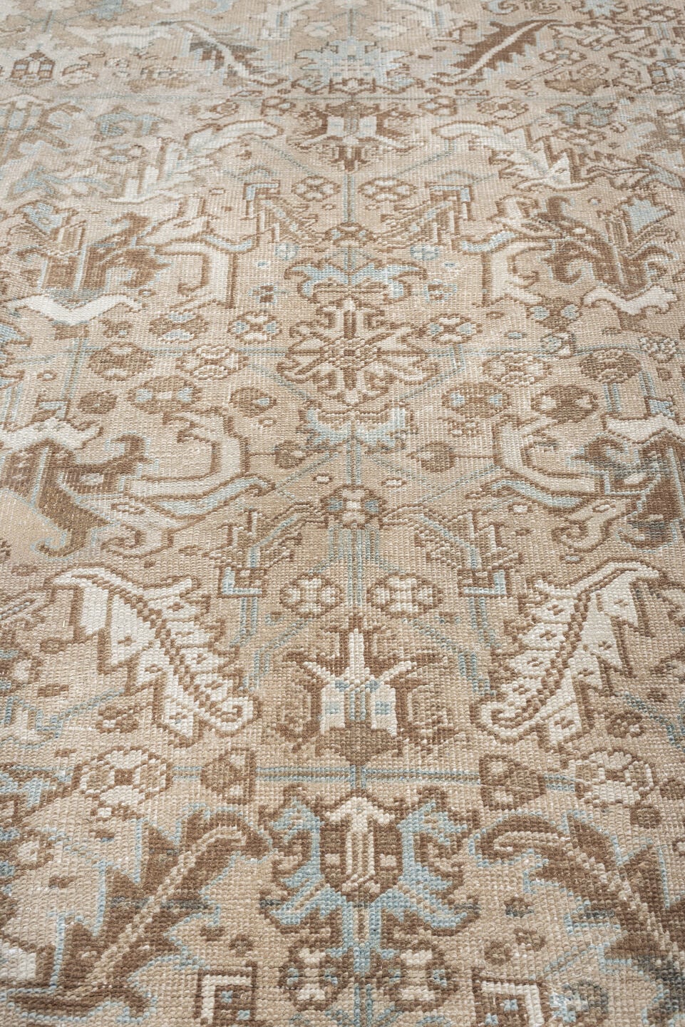 7' x 10' one-of-a-kind handmade antique Heriz large size rug. Color palette: taupe, brown, ivory, pale blue, charcoal, slate