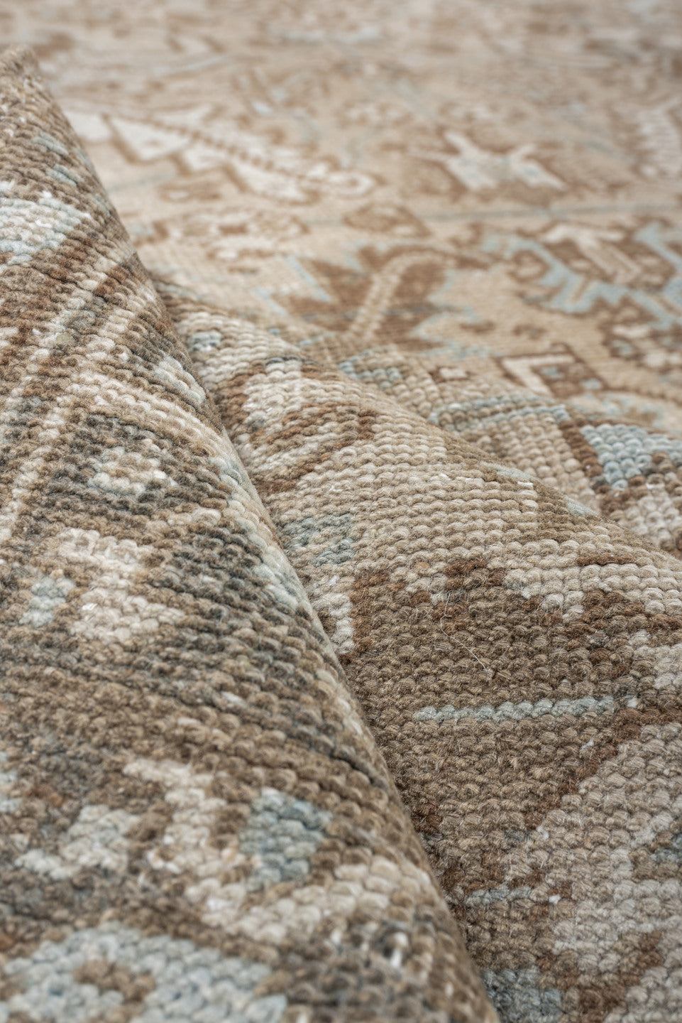 7' x 10' one-of-a-kind handmade antique Heriz large size rug. Color palette: taupe, brown, ivory, pale blue, charcoal, slate