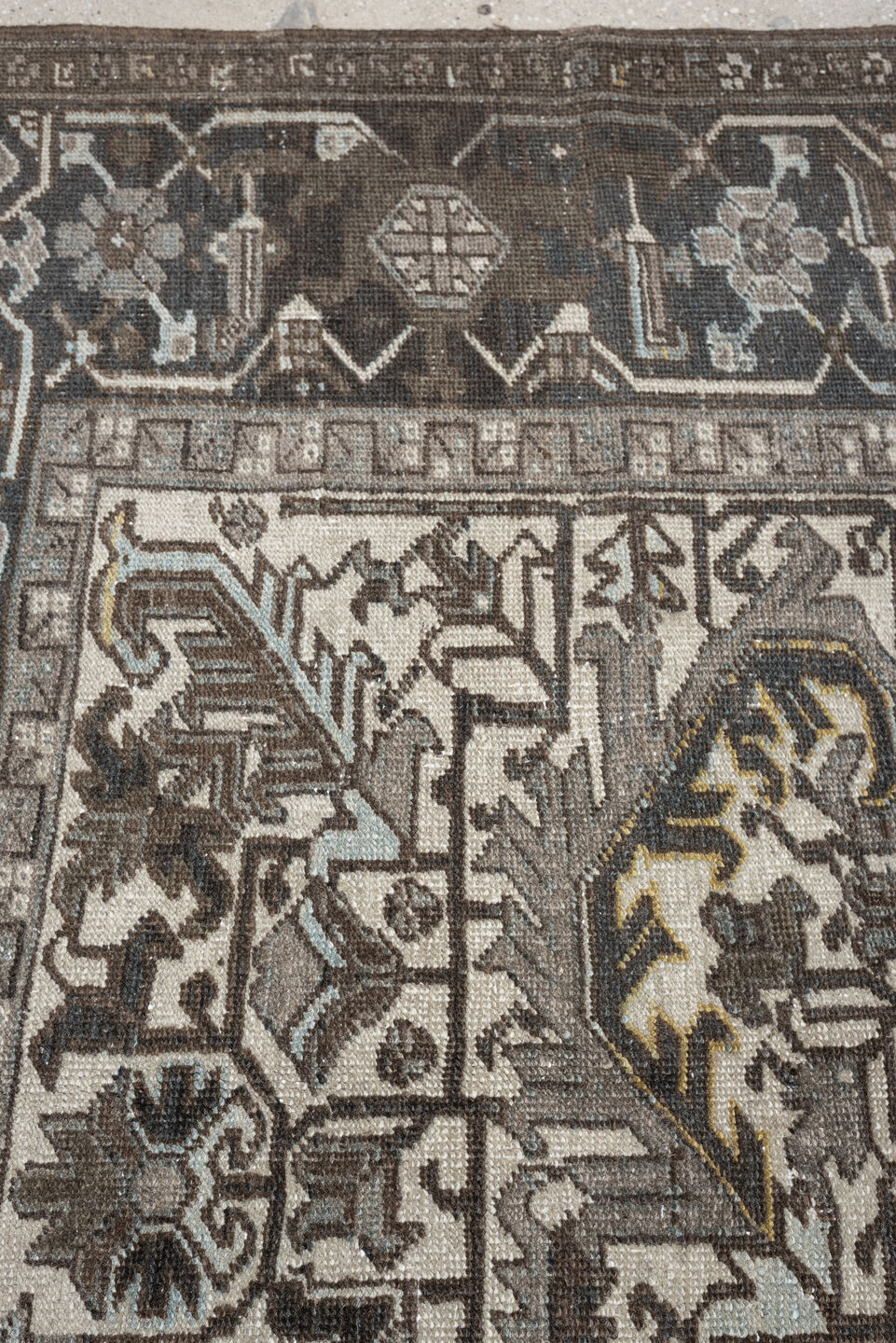 7' x 9' one-of-a-kind handmade antique Heriz large size rug. Color palette: ivory, charcoal, taupe, slate blue, olive, camel
