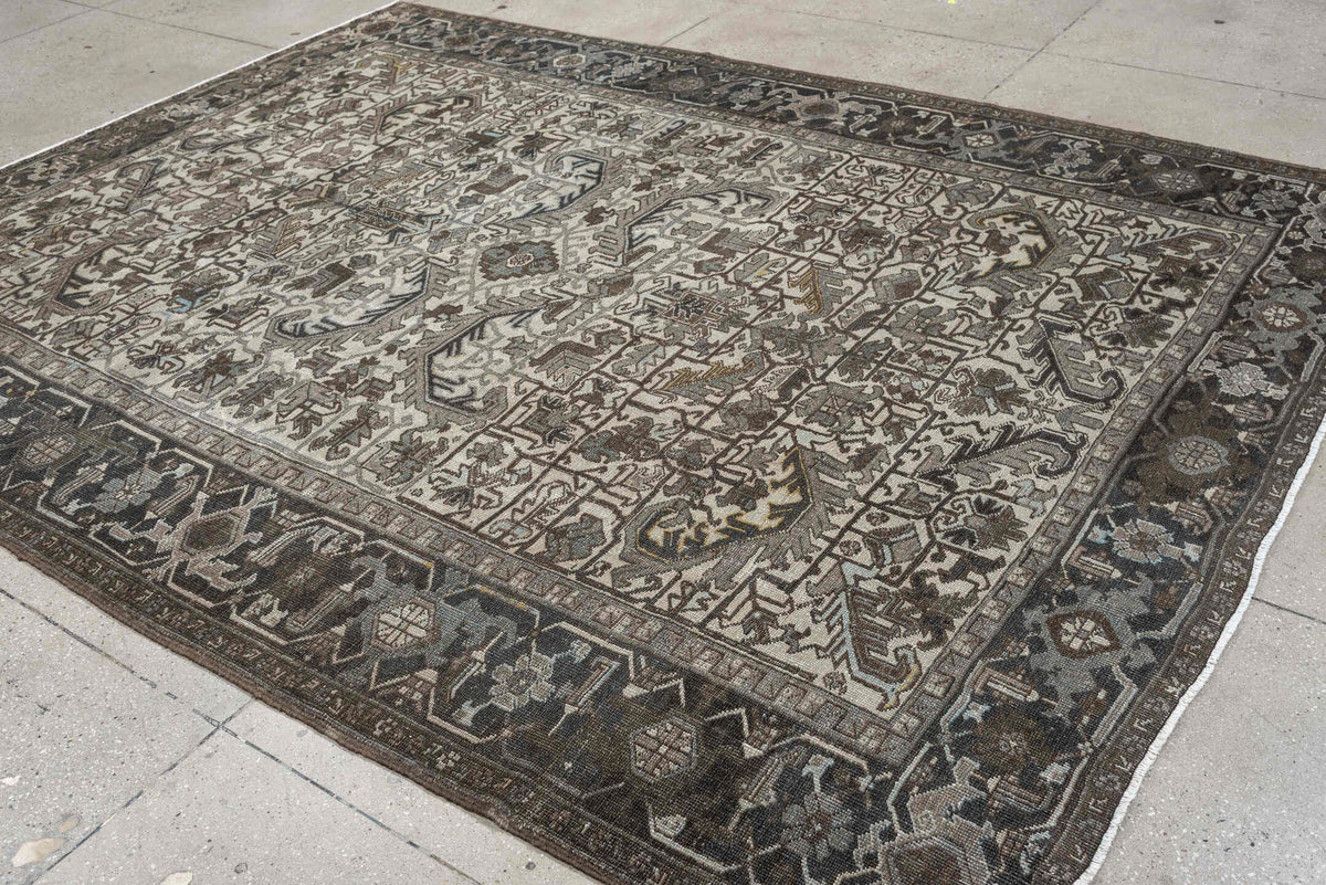 7' x 9' one-of-a-kind handmade antique Heriz large size rug. Color palette: ivory, charcoal, taupe, slate blue, olive, camel