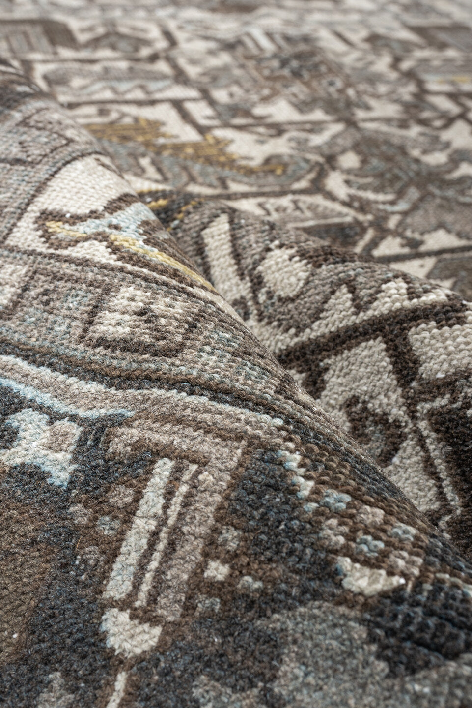7' x 9' one-of-a-kind handmade antique Heriz large size rug. Color palette: ivory, charcoal, taupe, slate blue, olive, camel