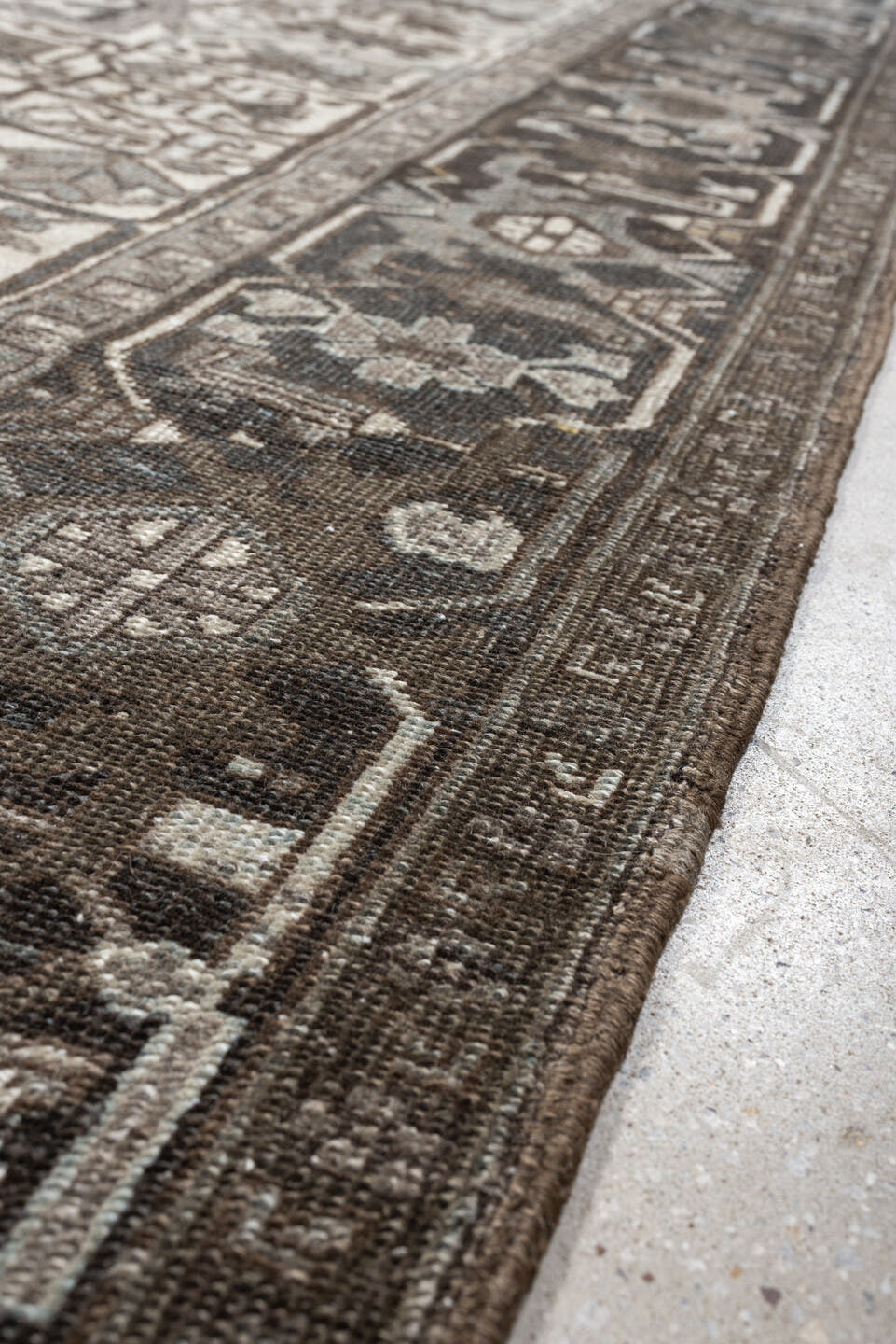 7' x 9' one-of-a-kind handmade antique Heriz large size rug. Color palette: ivory, charcoal, taupe, slate blue, olive, camel