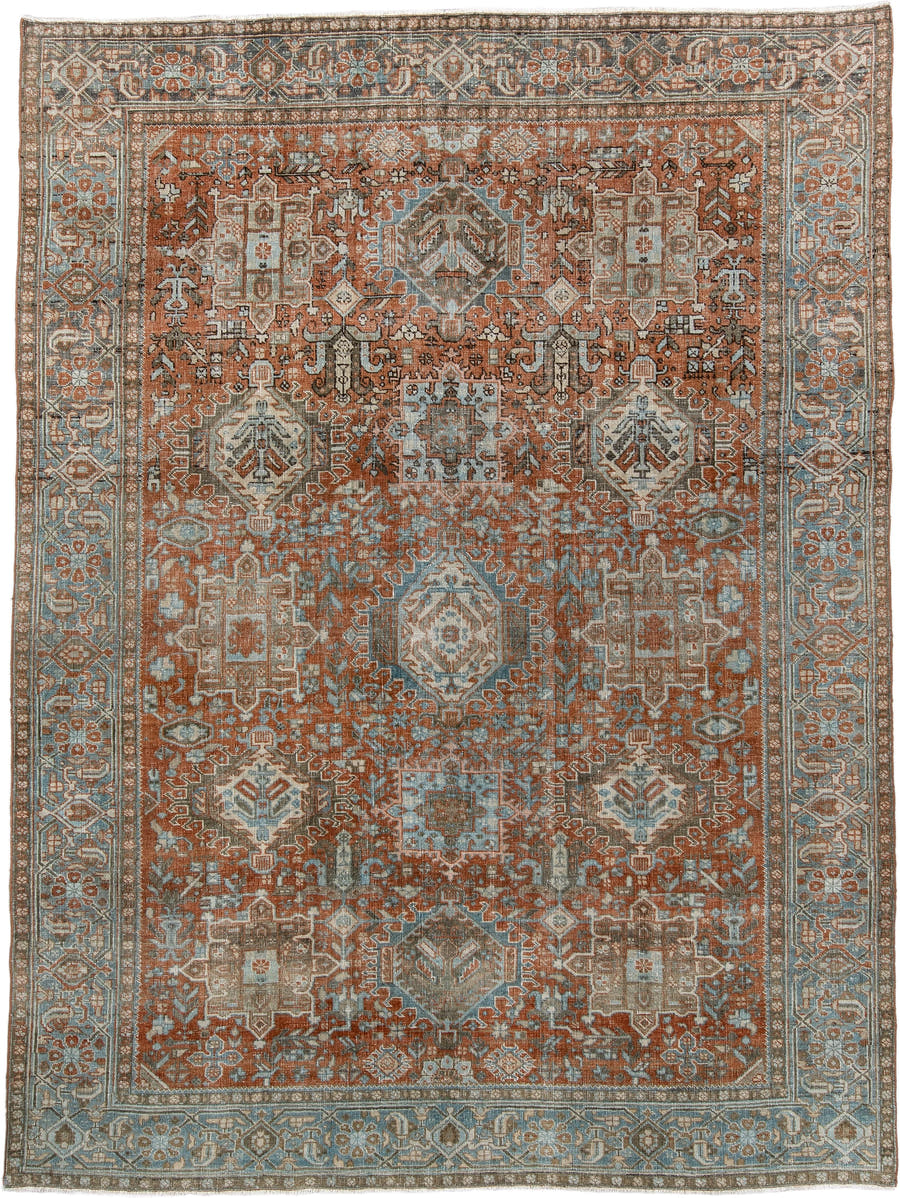 7' x 9' one-of-a-kind handmade antique Heriz large size rug. Color palette: rust, blue gray, ivory, terra cotta, charcoal