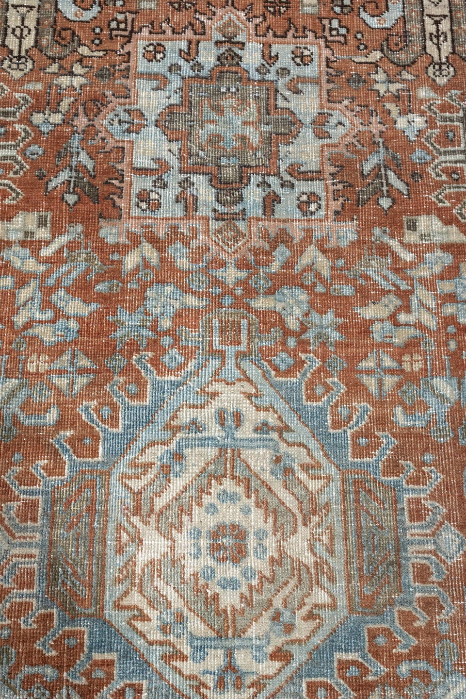 7' x 9' one-of-a-kind handmade antique Heriz large size rug. Color palette: rust, blue gray, ivory, terra cotta, charcoal