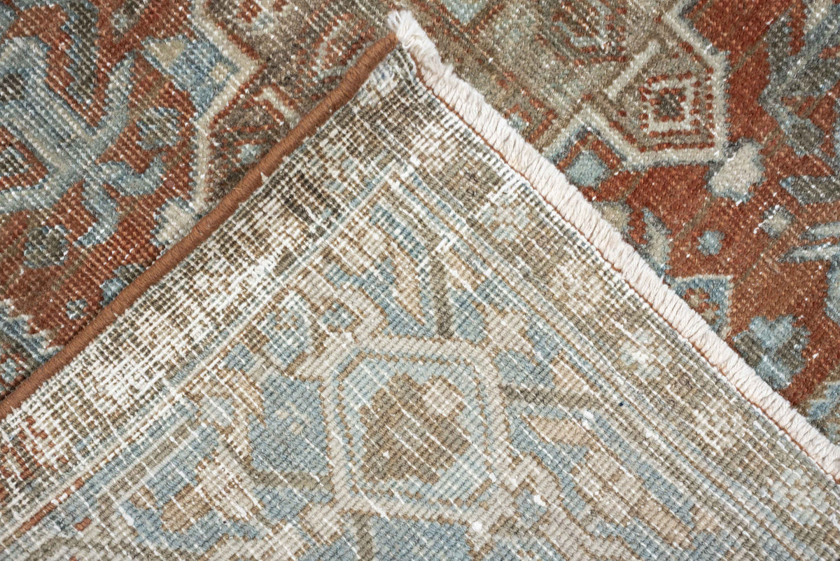 7' x 9' one-of-a-kind handmade antique Heriz large size rug. Color palette: rust, blue gray, ivory, terra cotta, charcoal