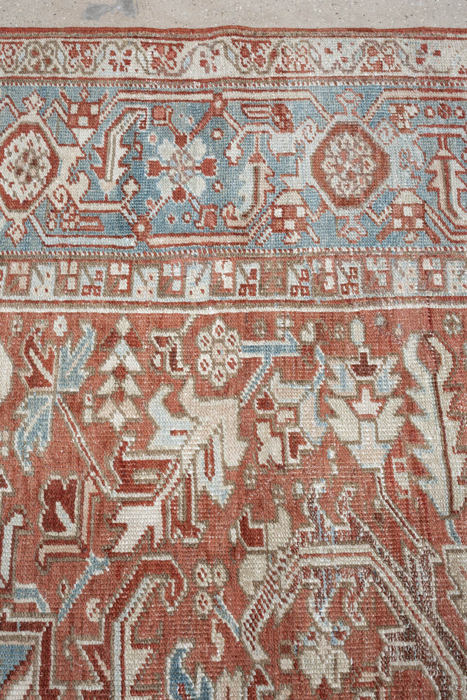 7' x 10' one-of-a-kind handmade antique Heriz large size rug. Color palette: terra cotta, ivory, blue gray, rust, pale blue
